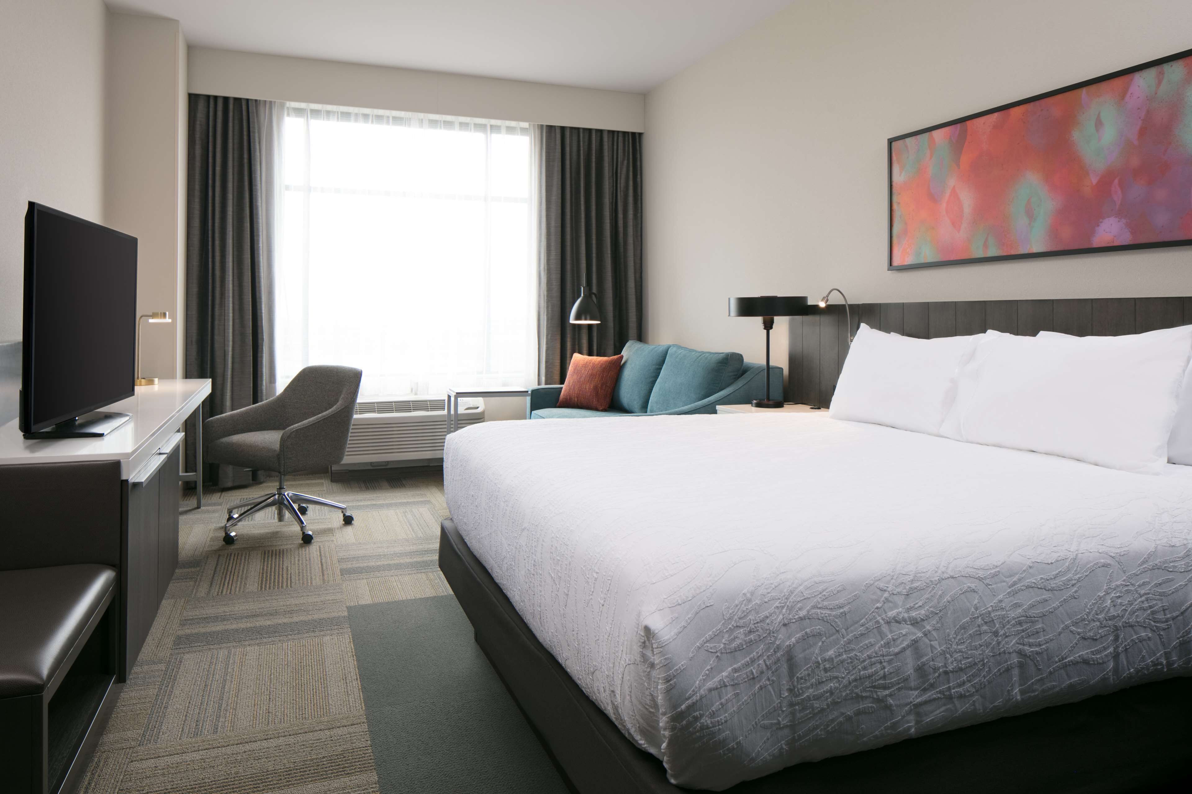 room, 1 king bed with sofa bed | premium bedding, blackout curtains, iron/ironing board