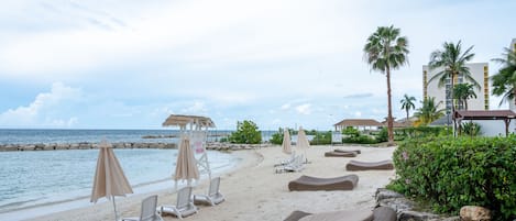 On the beach, sun-loungers, beach towels