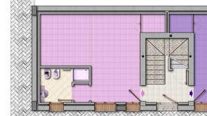 Plano de planta de una habitación de hotel con baño, ducha y una pequeña kitchenette.