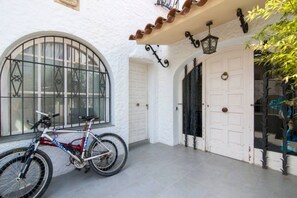 Guests can park their bicycles against the exterior wall, with a door leading to the interior.