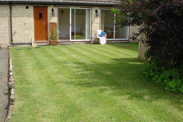 Level lawn at the front catches the afternoon sunshine