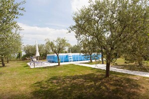 Enjoy a peaceful retreat amidst lush surroundings and a serene structure in the distance.