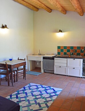 Fridge, stovetop, cookware/dishes/utensils, dining tables