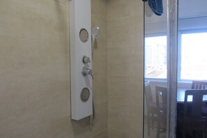 Shower, hair dryer, towels, soap