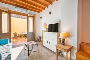 TV, fireplace, books, offices