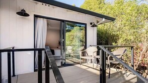 A modern, compact building with a balcony, a sliding glass door, and outdoor seating. - Casa Sonoma, Saline Pool, Hot Tub and Bocce (Sonoma)