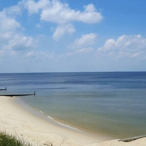 On the beach, sun-loungers