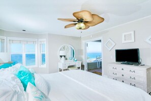 Relax in this serene retreat with a large bed, flat-screen TV, and ocean views.
