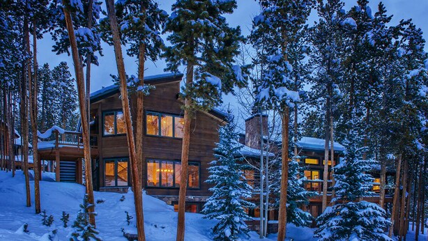 A multi-story lodge with a wooden exterior, surrounded by snow-covered trees. - SmallGroup-SmallRate! Great Layout/Views/HotTub/PoolTable/Grills/Ski In Ski Out! (Breckenridge)
