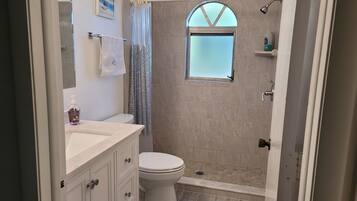 Shower, hair dryer, towels, soap