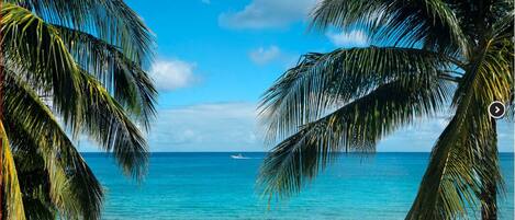 On the beach, sun loungers, beach towels