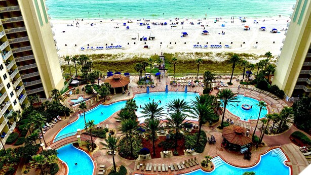 A resort with a large pool area, a beach, and a view of the ocean. - No Resort Fee~Gulf Front Double Balcony~Free Resort Chairs~Reserved Parking Spot (Panama City Beach)
