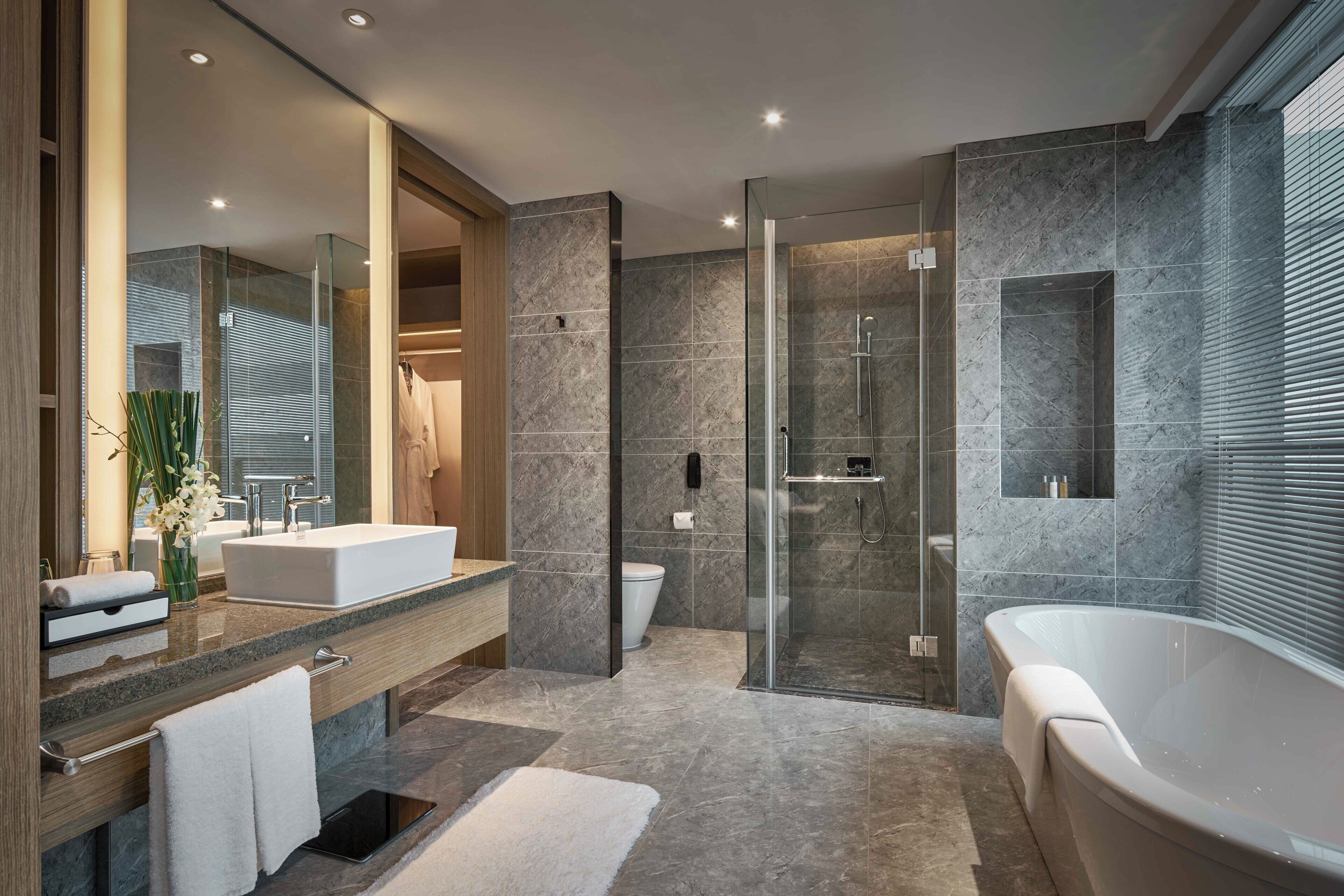 superior suite | bathroom | shower, designer toiletries, hair dryer, slippers