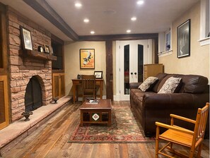 TV, fireplace, books, music library