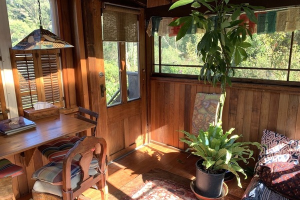 upstairs porchroom also acts as an inspiring writing station or office