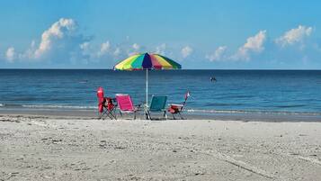 On the beach, sun loungers, beach towels