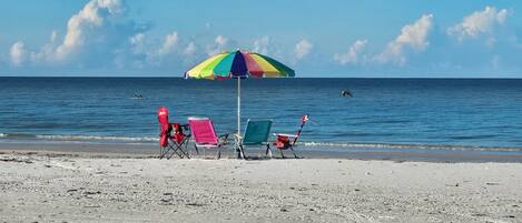 On the beach, sun loungers, beach towels