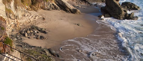 On the beach, sun loungers, beach towels