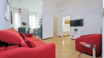 TV LCD, lettore DVD, libri, impianto stereo