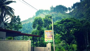 A signboard advertising a holiday bungalow with a tea center. - Rockview Holiday Bungalow (Ukuwela)