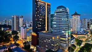 A high-rise hotel with multiple floors, a prominent entrance, and a modern architectural design. - YOTEL Singapore Orchard Road (Singapore)