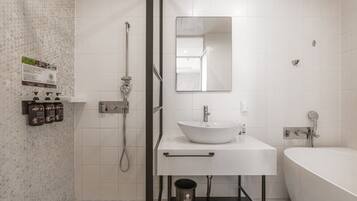 Separate tub and shower, hair dryer, slippers, bidet