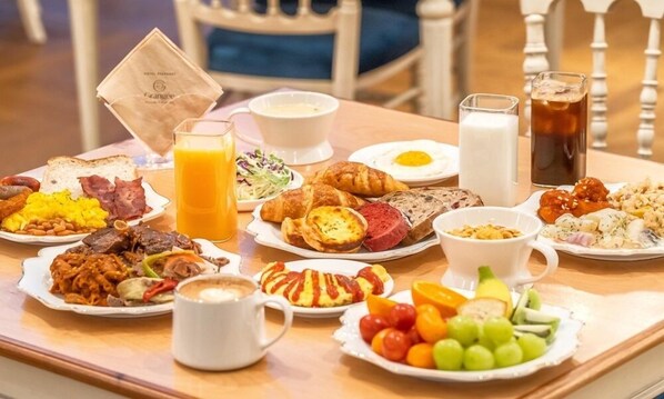 A breakfast buffet with various dishes, drinks, and a paper bag on a table. - February Hotel The Signature Dongseongro (Daegu)