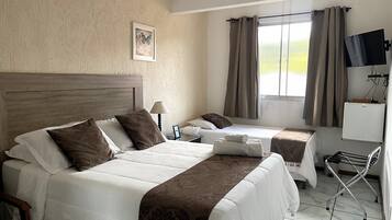 Comfort Room | 1 bedroom, minibar, iron/ironing board, free WiFi