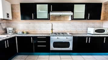 Deluxe Apartment, 2 Bedrooms, Terrace | Private kitchen | Full-size fridge, microwave, oven, stovetop