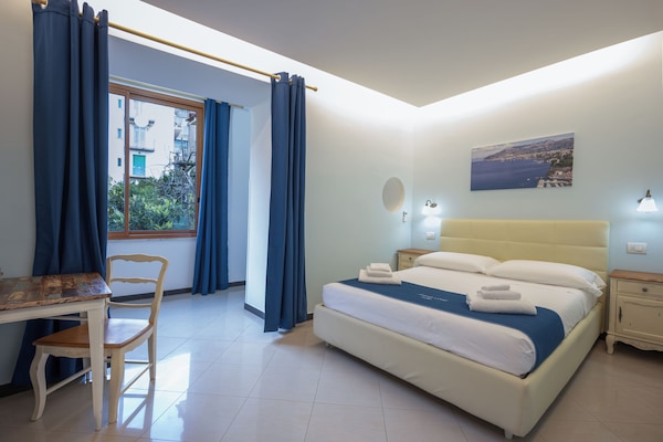 Deluxe Quadruple Room | Minibar, desk, blackout drapes, WiFi (free)