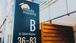 A sign for 'mtona morena' with the address 'ul. Dolne Migowo 36-83'. - Elite Apartments Nature & Recess (Gdansk)