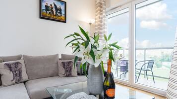 Apartment, 1 Bedroom | Living room | Flat-screen TV