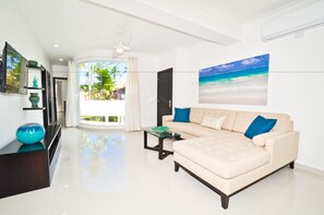 Second Floor Condo with Balcony | Living area | 37-inch Smart TV with digital channels, streaming services - The Sanctuary at Los Corales (Punta Cana)