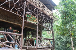 A rustic wooden structure with a sign reading "KOPI DOA Street Haus." - Kopi Doki Guest Haus (Coron)