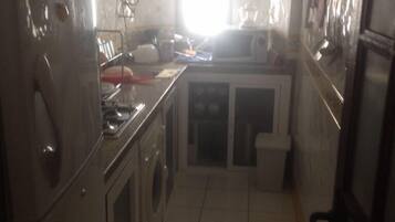 Apartment, 2 Bedrooms | Private kitchen | Full-size fridge, microwave, oven, stovetop