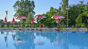 2 outdoor pools, open 10 AM to 7 PM, pool umbrellas, pool loungers