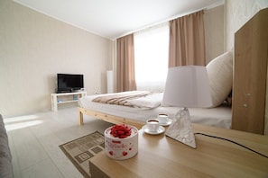 Premium bedding, desk, laptop workspace, iron/ironing board