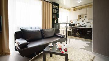 Apartment on Gorkogo 34 | Living area | Flat-screen TV