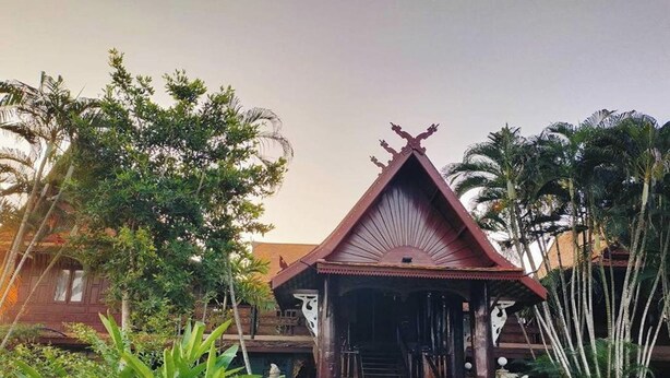 A traditional wooden structure with a triangular roof, surrounded by lush greenery. - Viewdoi Art and Resort by Zuzu (Chiang Mai)