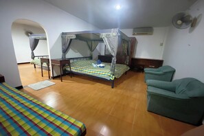 A room with a bed, a chair, a desk, and a fan. - Viewdoi Art and Resort by Zuzu (Chiang Mai)