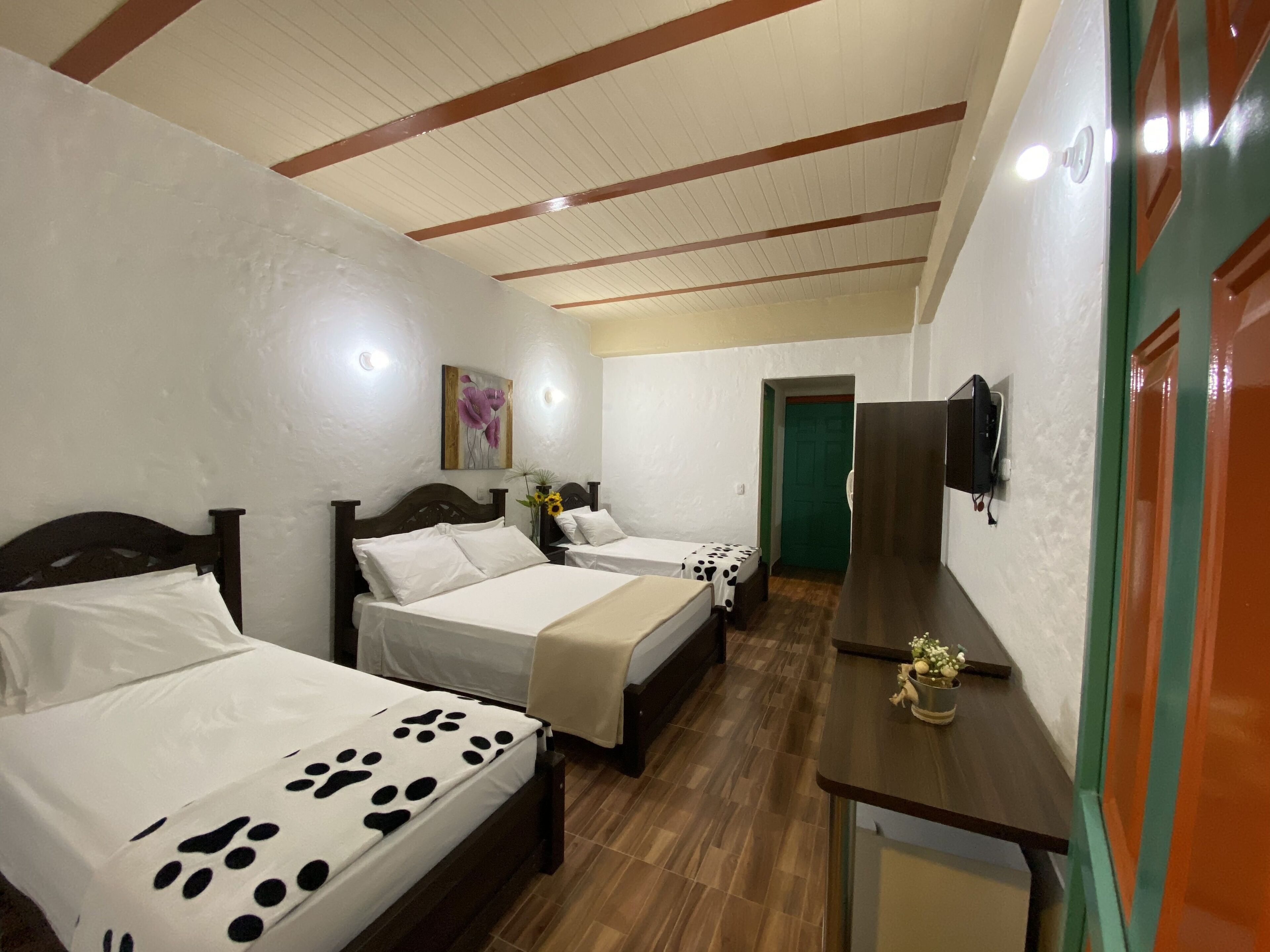 standard quadruple room | 1 bedroom, in-room safe, desk, iron/ironing board