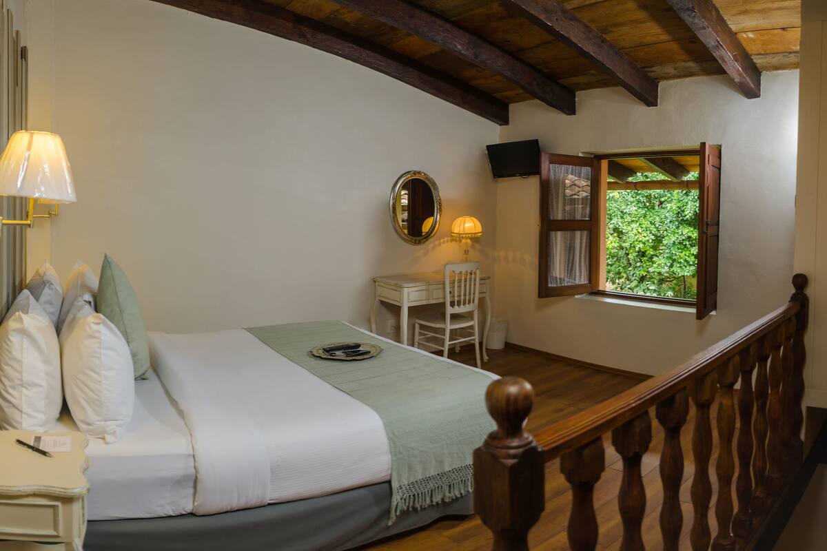 Junior Suite, 1 Queen Bed | In-room safe, desk, iron/ironing board, free cots/infant beds