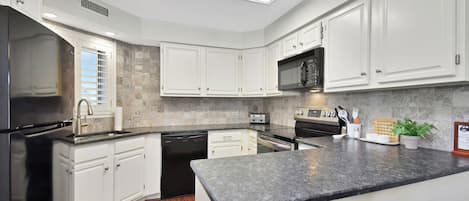 Fridge, microwave, stovetop, coffee/tea maker