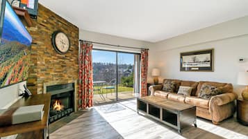 Condo, 1 Bedroom (Efficiency) | Living area | Flat-screen TV