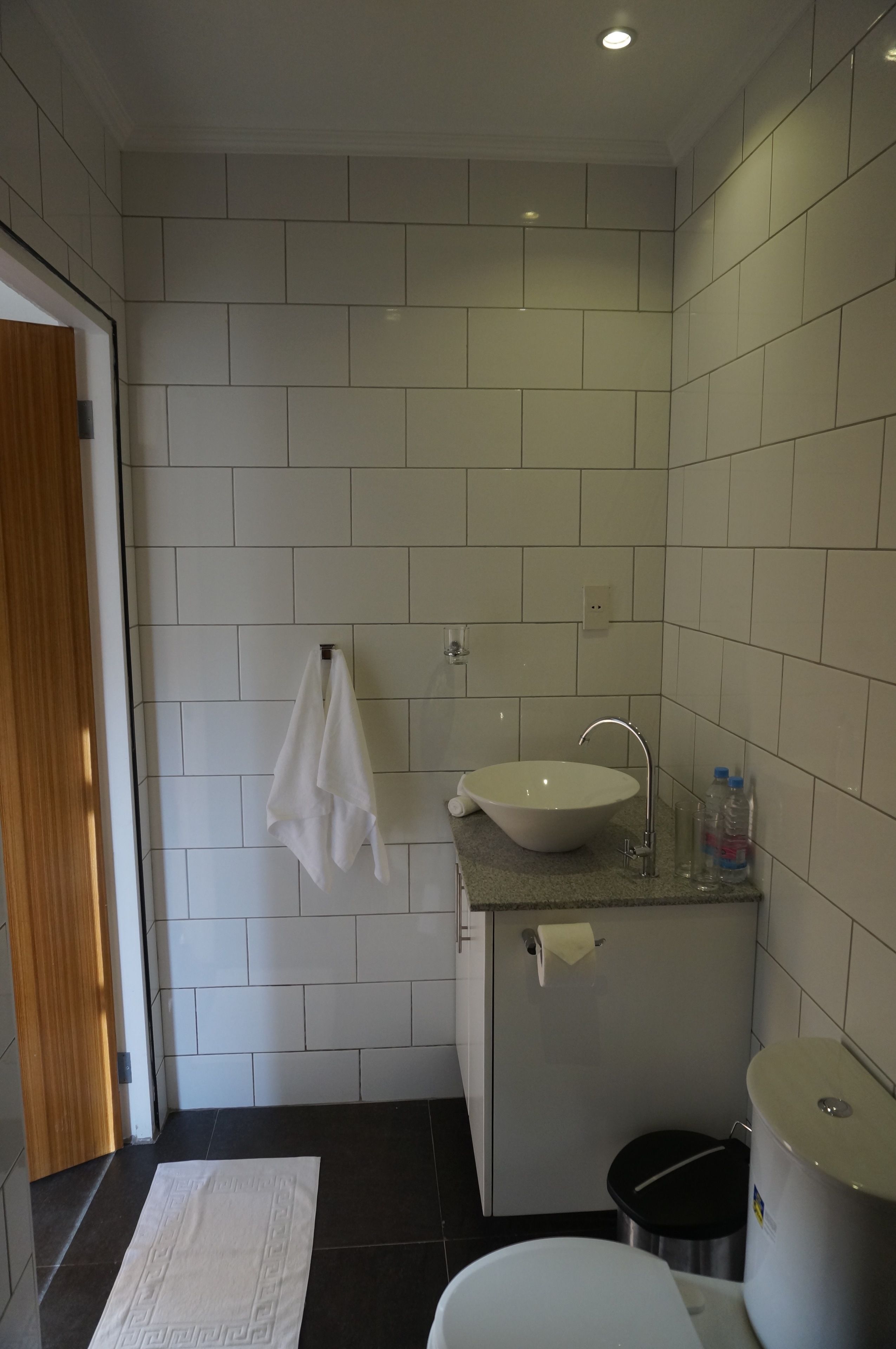 queen suite with pool view | bathroom | shower, slippers, towels