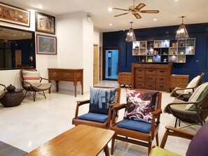 Relax in style with a comfortable seating area and ample storage options.