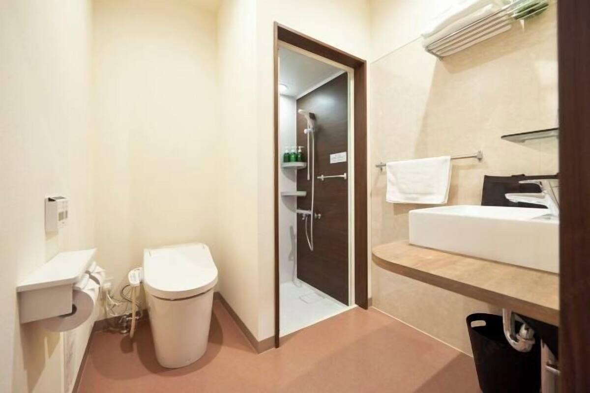 Bathroom | Shower, free toiletries, slippers, electronic bidet