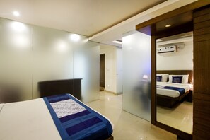 Deluxe Double Room, 1 Bedroom, Smoking, City View | In-room safe, desk, blackout drapes, iron/ironing board