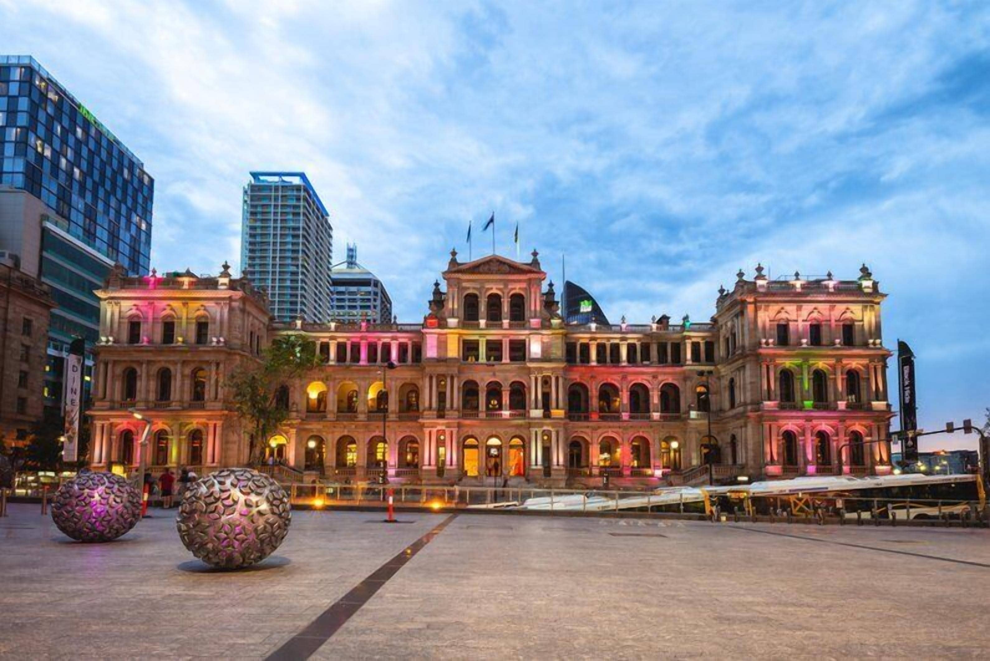 A historic building with classical architecture, featuring multiple arches and a central courtyard.
