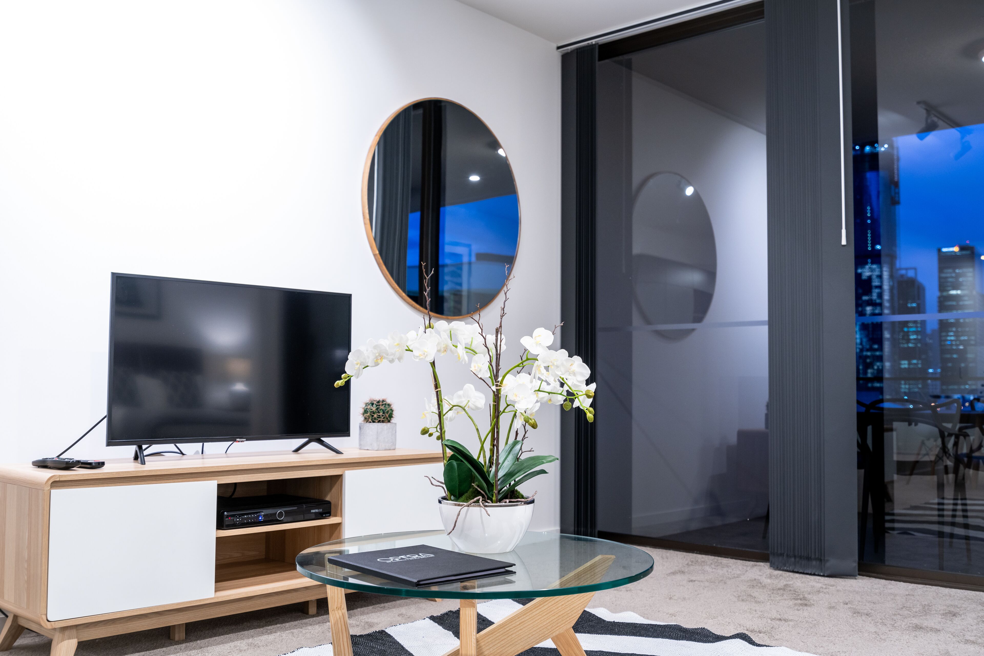 1 bedroom apartment standard view | living area | 42-inch lcd tv with cable channels, tv, dvd player